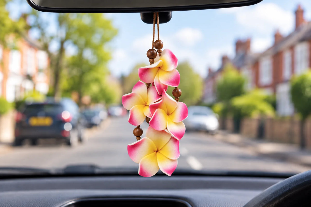 Bahama & Co. Waikiki Wild Hibiscus flower necklace air freshener hanging from a car's rear-view mirror