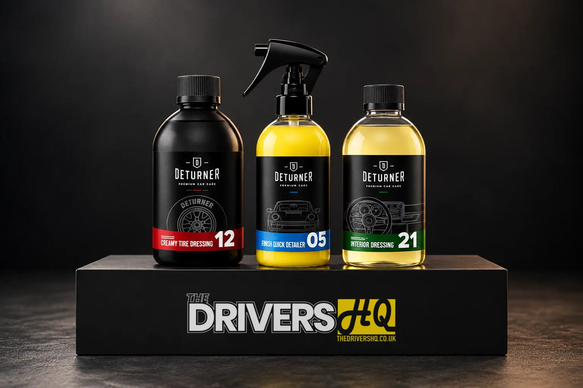 Deturner Creamy Tire Dressing, Finish Quick Detailer and Interior Dressing bottles on a black display plinth