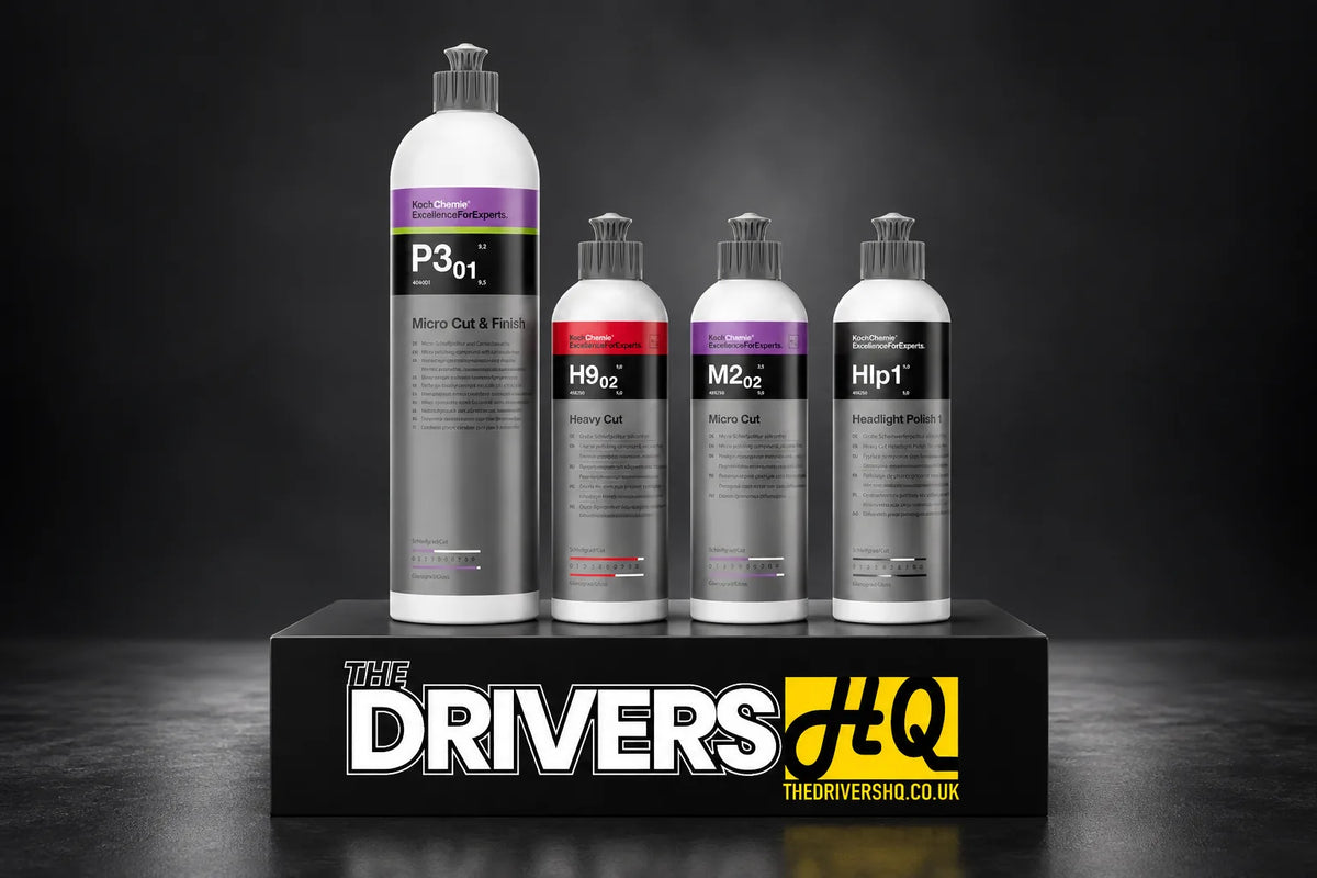 Koch-Chemie Micro Cut and Finish P3.01, Heavy Cut H9.02, Micro Cut M2.02 and Headlight Polish 1 on a black display plinth in a photo studio