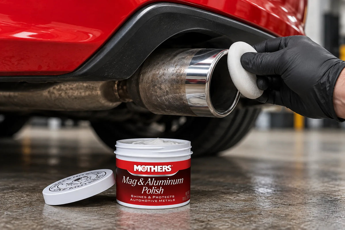 Mothers Mag & Aluminum Polish used to polish the stainless exhaust tip of a red car