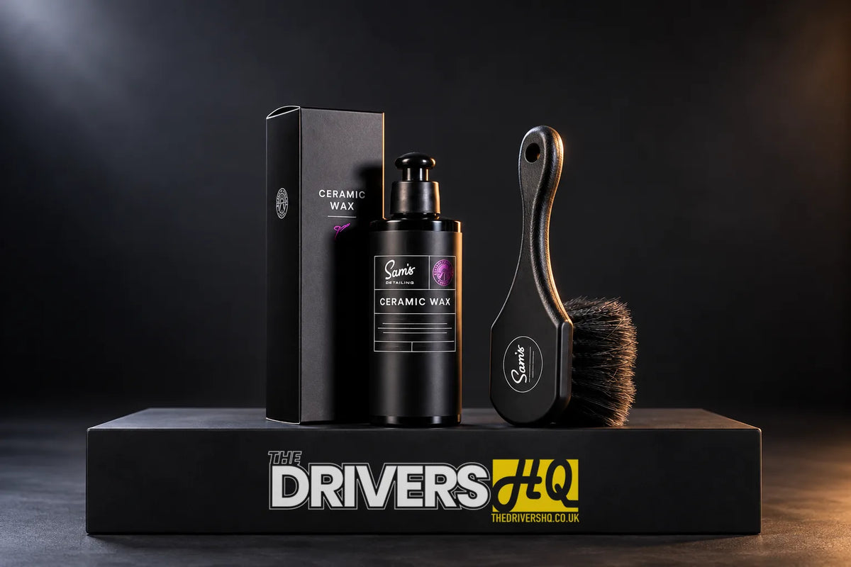Sam's Detailing Ceramic Wax bottle with its box and the Sam's Detailing flagged tip wheel brush on a black display plinth