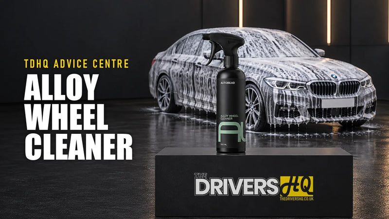 Best alloy wheel cleaner UK: AutoBead Alloy Wheel Cleaner on The Drivers HQ display plinth in front of a snow-foamed BMW 5 Series