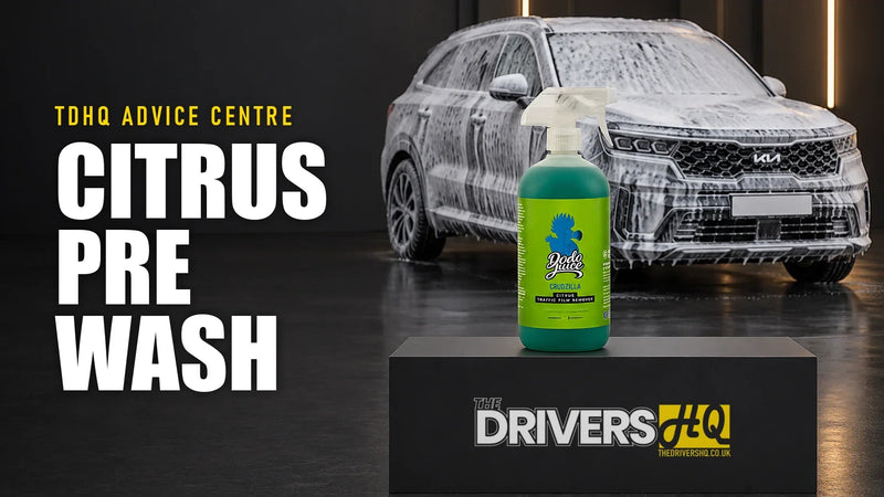 Best citrus pre-wash UK: Dodo Juice Crudzilla on The Drivers HQ display plinth in front of a grey Kia Sorento covered in snow foam