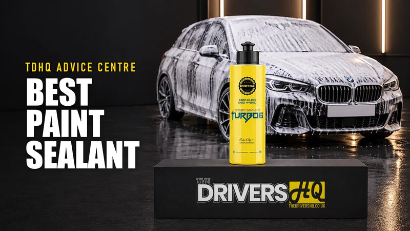 Best paint sealant UK: Infinity Wax Turbo6 cream sealant on The Drivers HQ display plinth in front of a black BMW 1 Series hatchback covered in snow foam