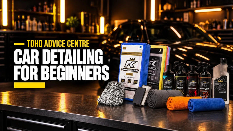 Car detailing for beginners: the FibreKing Complete Car Cleaning Kit with microfibre cloths, wash mitt, drying towels and cleaners on a garage workbench