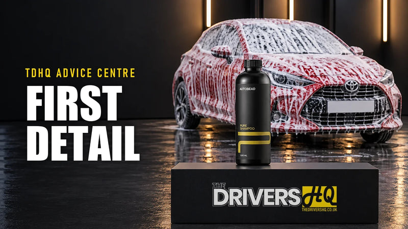 Car detailing for beginners: AutoBead Pure Shampoo on The Drivers HQ display plinth in front of a snow-foamed Toyota Yaris