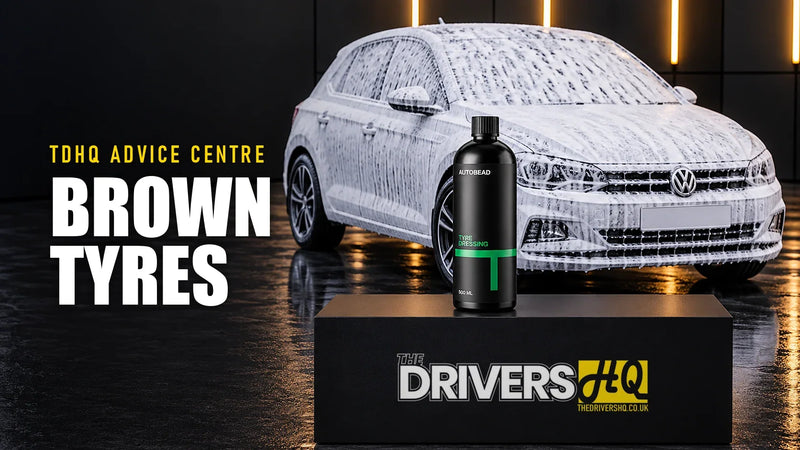 How to remove tyre browning: AutoBead Tyre Dressing on The Drivers HQ display plinth in front of a white VW Polo covered in snow foam