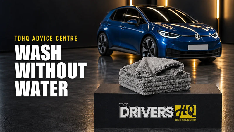 How to use a waterless car wash: a stack of FibreKing microfibre cloths on The Drivers HQ display plinth in front of a blue VW ID.3