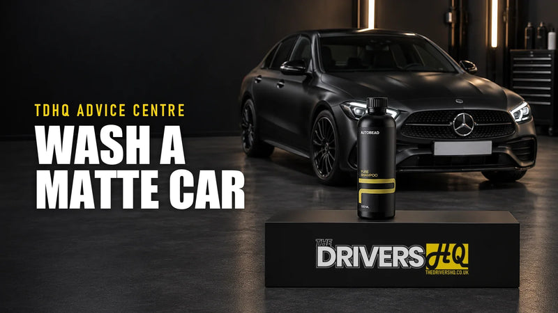 How to wash a matte car: AutoBead Pure Shampoo on The Drivers HQ display plinth in front of a matte black Mercedes-Benz C-Class