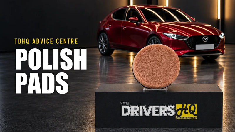 Polishing pads explained: an AutoBead Downforce heavy cut foam pad on The Drivers HQ display plinth in front of a red Mazda 3