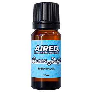 A 10ml amber glass bottle of Aired Ocean Drift Essential Oil with a black ribbed cap and a light blue label, shown on a plain white background.