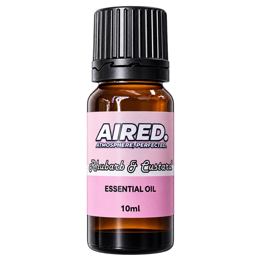 A 10ml amber glass bottle of Aired Atmosphere Perfected essential oil with a pink label and a black ribbed cap, isolated on a white background.