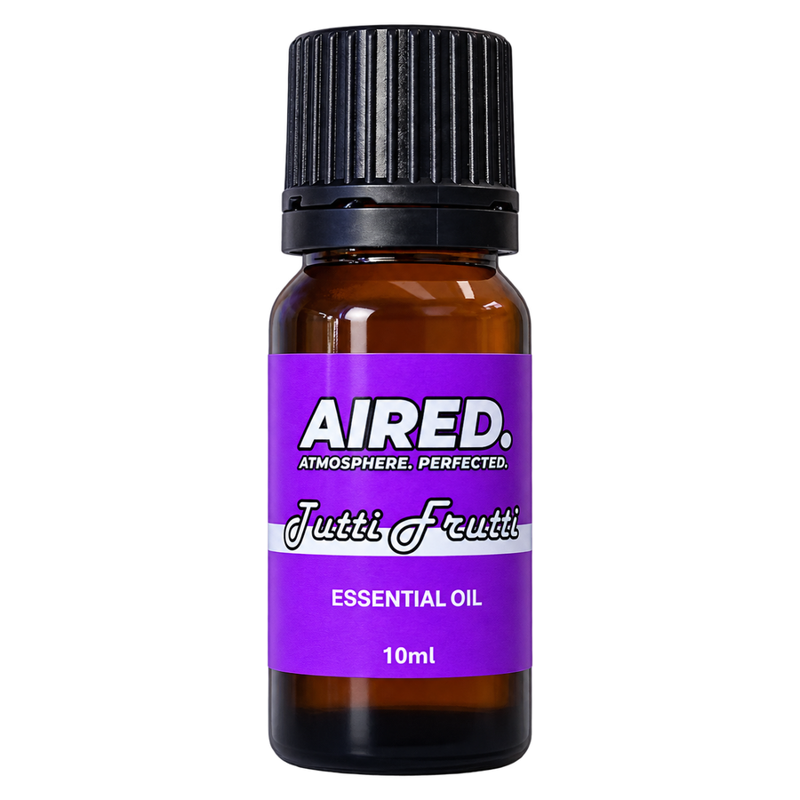 A 10ml amber glass bottle of Aired Tutti Frutti essential oil with a black ribbed cap and a purple label, shown on a plain white background.