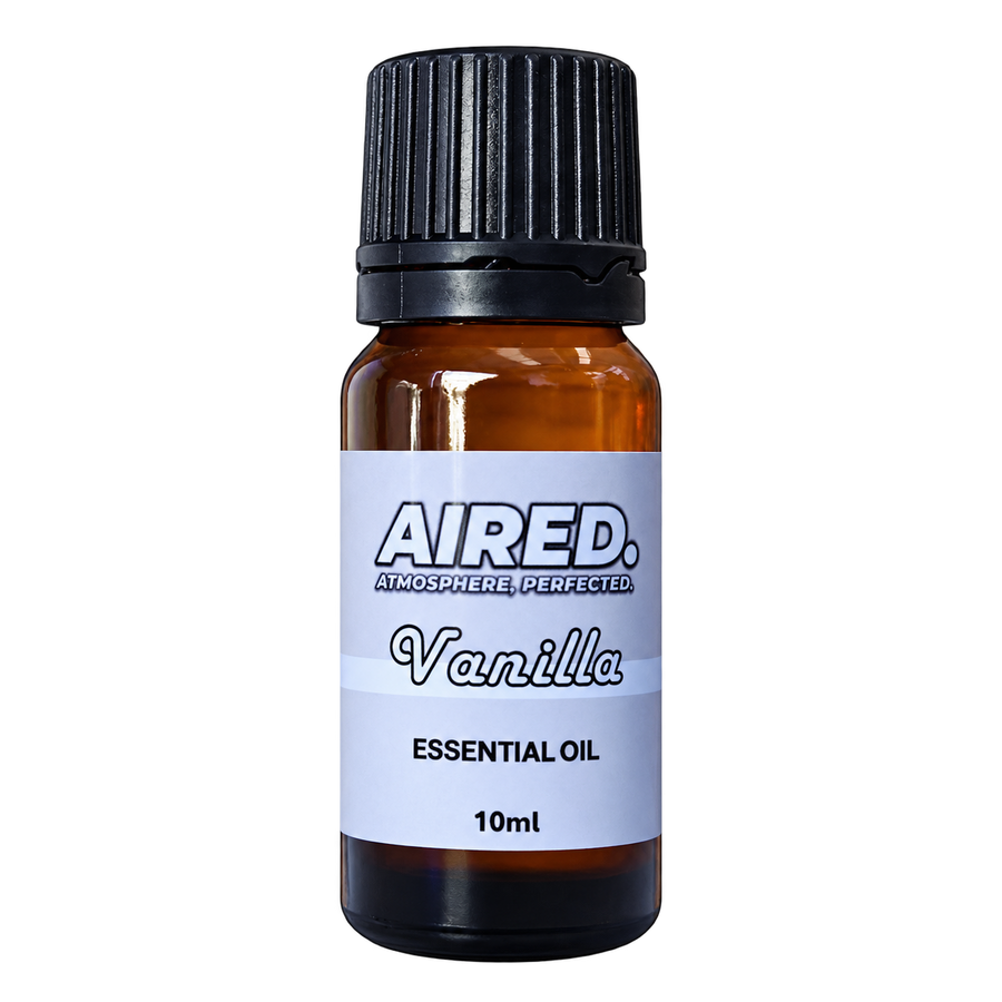 A 10ml amber glass bottle of Aired Vanilla Essential Oil with a black ribbed cap and a white label, shown on a plain white background.