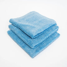 FibreKing Duplex edgeless cloth, three light blue cloths folded and stacked on a white background