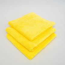 FibreKing Duplex edgeless cloth, three yellow cloths folded and stacked on a white background