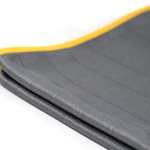 FibreKing Carbon Glass Cloths, side view of the folded cloth showing its layers and yellow edge