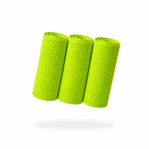 FibreKing Waffle Weave glass towels in green, three towels rolled up showing the waffle texture