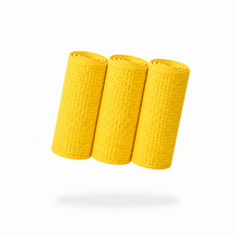 FibreKing Waffle Weave glass towels in yellow, three towels rolled up showing the waffle texture