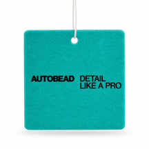 Autobead air freshener in Clean scent, a teal felt card printed AUTOBEAD DETAIL LIKE A PRO, on a white background