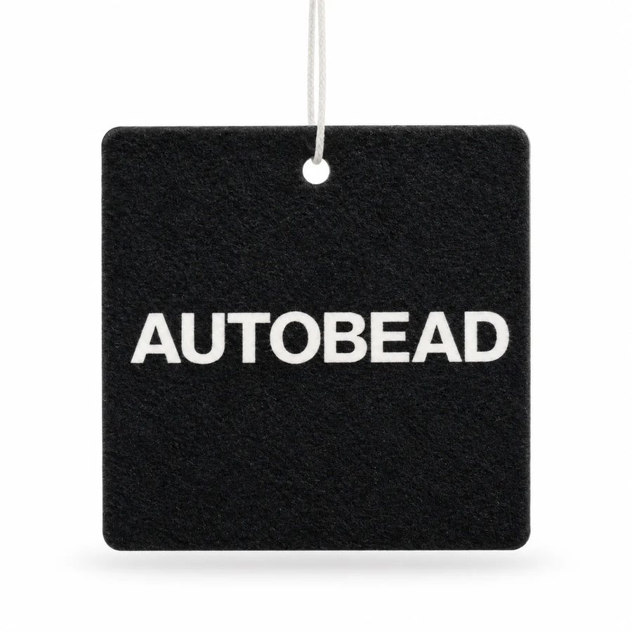 Autobead air freshener in Cranberry scent, a black felt card printed AUTOBEAD in white, on a white background