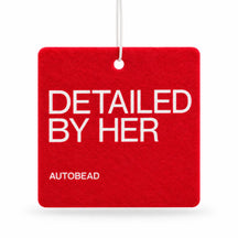 Autobead air freshener in Oriental Nights scent, a red felt card printed DETAILED BY HER and AUTOBEAD, on a white background
