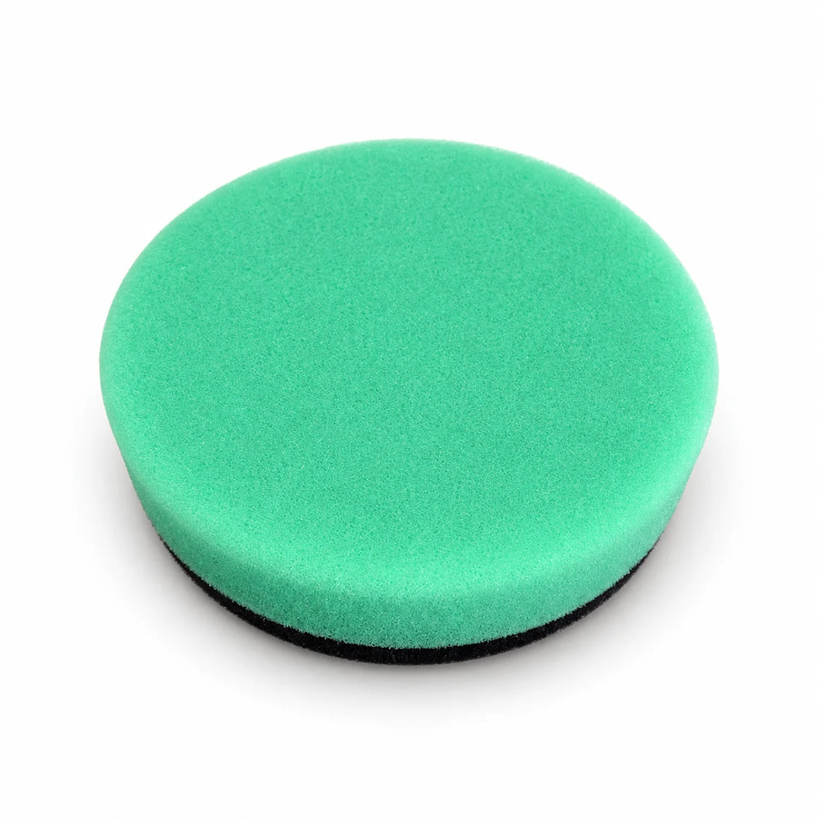 Autobead Downforce Fine Cut 3 inch foam polishing pad in mint green with a black hook and loop backing, studio photo on white