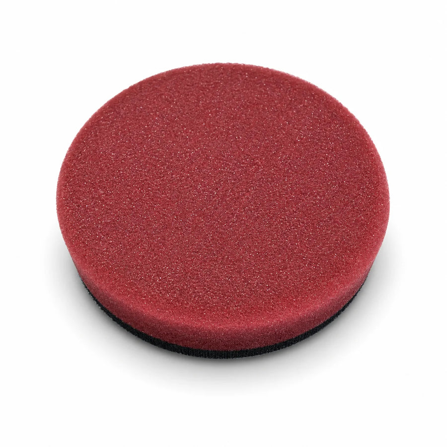 Autobead Downforce Medium Cut 3 inch foam polishing pad in maroon with a black hook and loop backing, studio photo on white