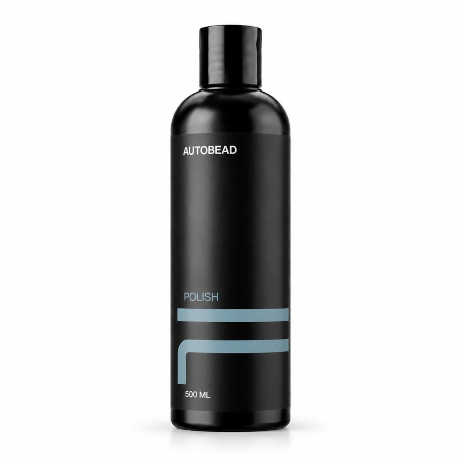 AutoBead Polish 500ml black bottle with a black disc cap and pale blue label lines on a white background