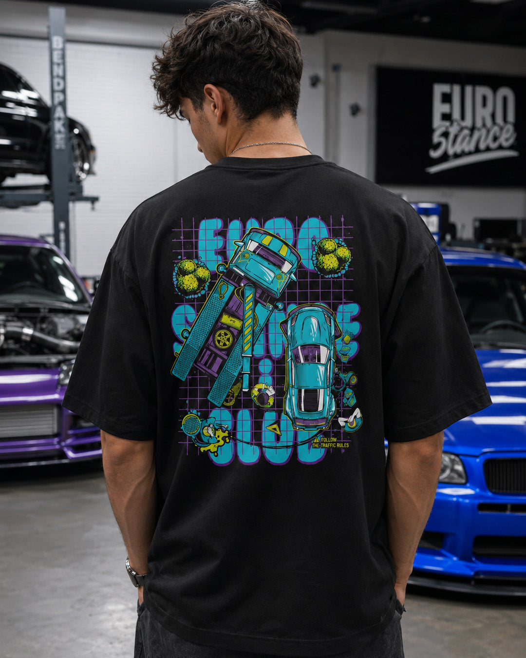 EuroStance Stance Club Crashed Tee, back print on the black tee worn in a car workshop