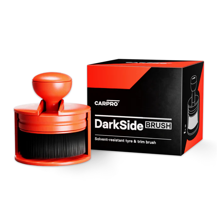 CarPro DarkSide Tyre Dressing Applicator Brush Regular 50mm beside its black and red box