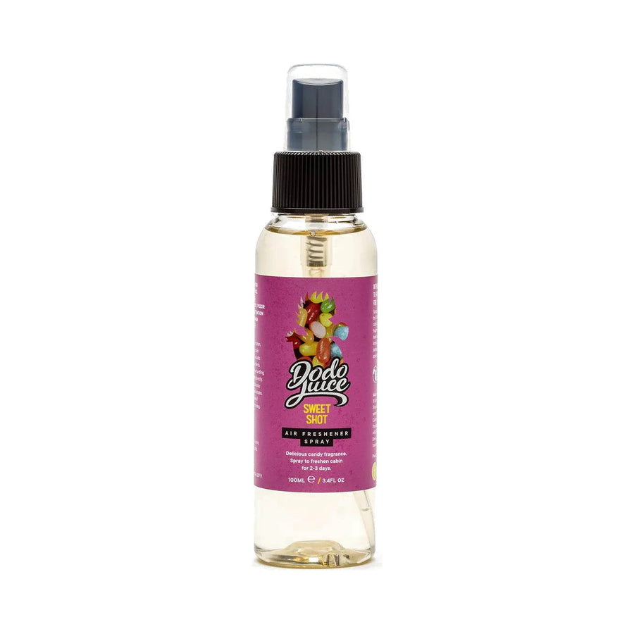 Dodo Juice Sweet Shot 100ml air freshener spray with pale amber liquid and a pink label, product photo on white