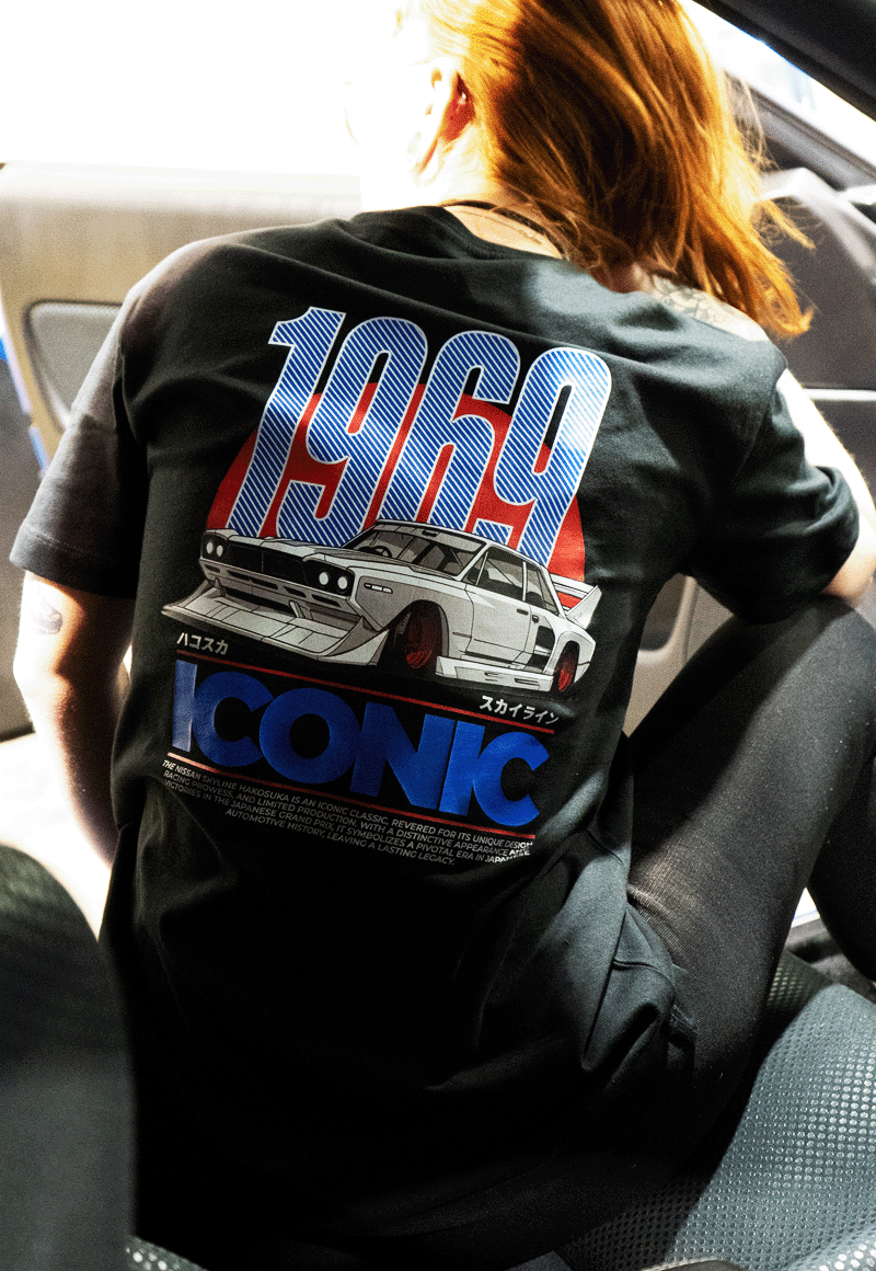 EuroStance 1960s Racing Division Tee, model in a car showing the 1969 Iconic back print