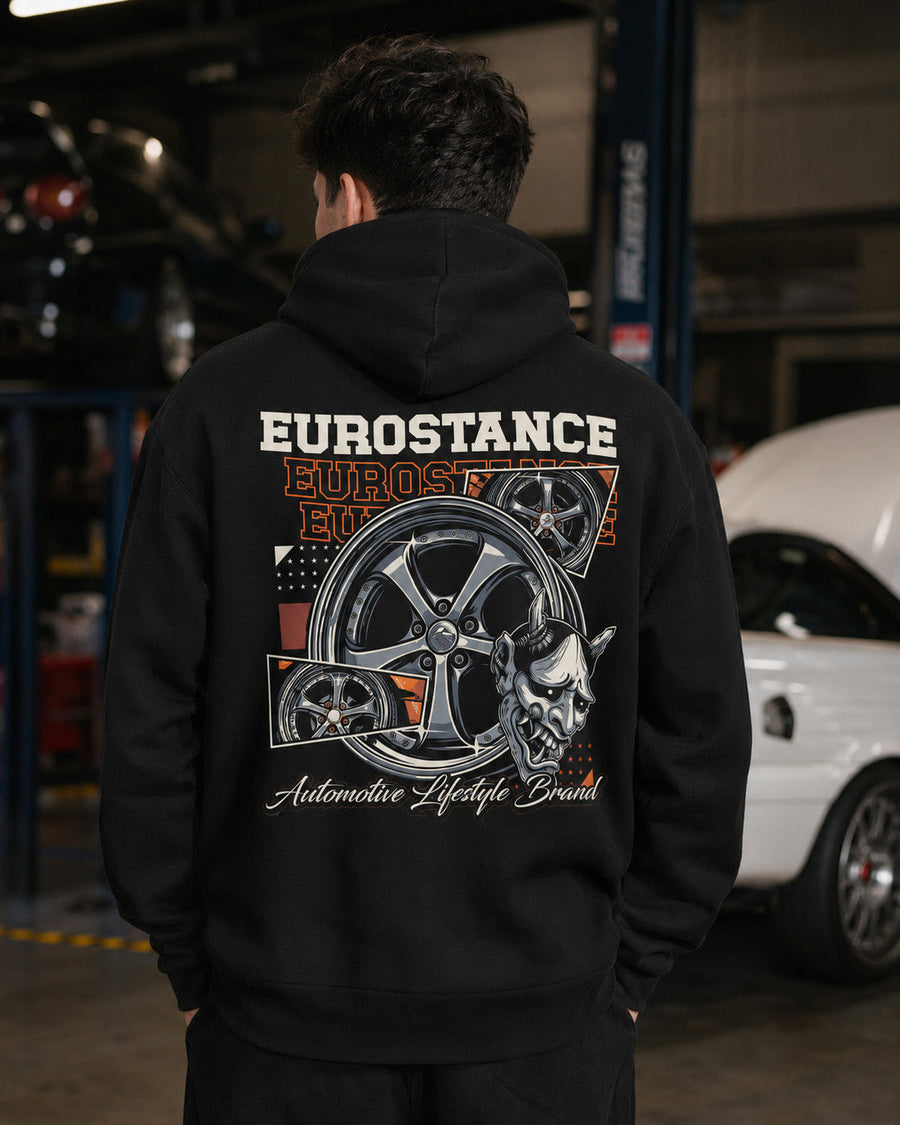 EuroStance VSKF ONI Hoodie worn in a garage, wheel and oni mask back print