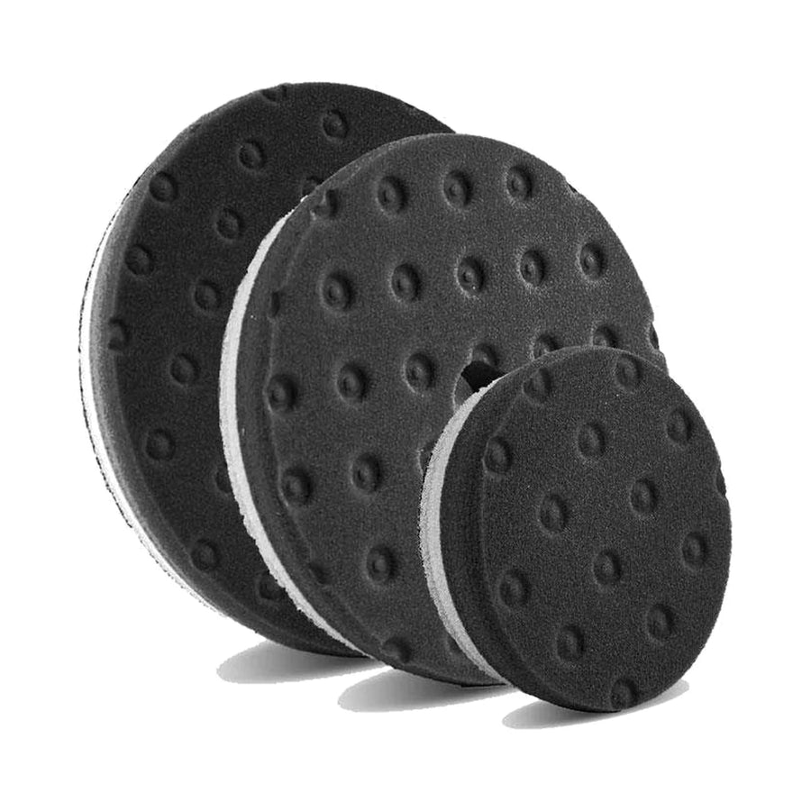 Lake Country HDO CCS black finishing pads in three sizes with the dimpled CCS face, product photo on white