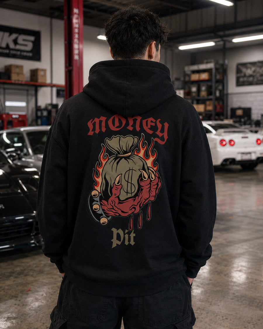 EuroStance Money Pit Hoodie, model in a workshop showing the flaming money bag back print