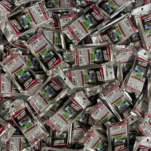 Bio-Bombs Bio-Fresh Bar Poppin Cherry, a pile of many sealed foil pouches seen from above