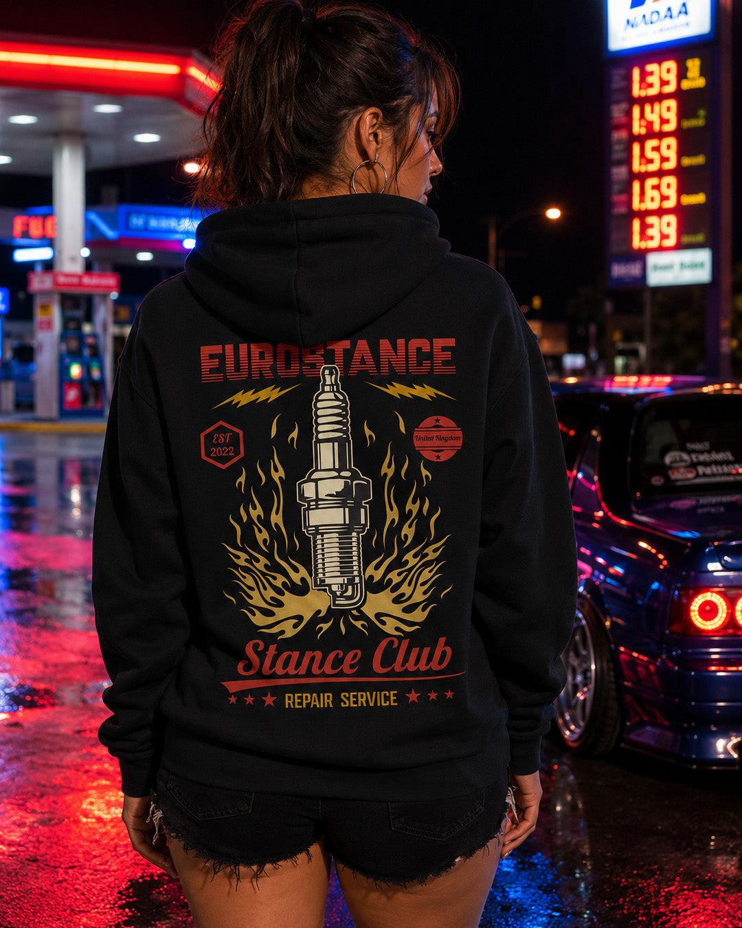 EuroStance Sparkplug Garage Hoodie in black on a model, back print of a flaming spark plug