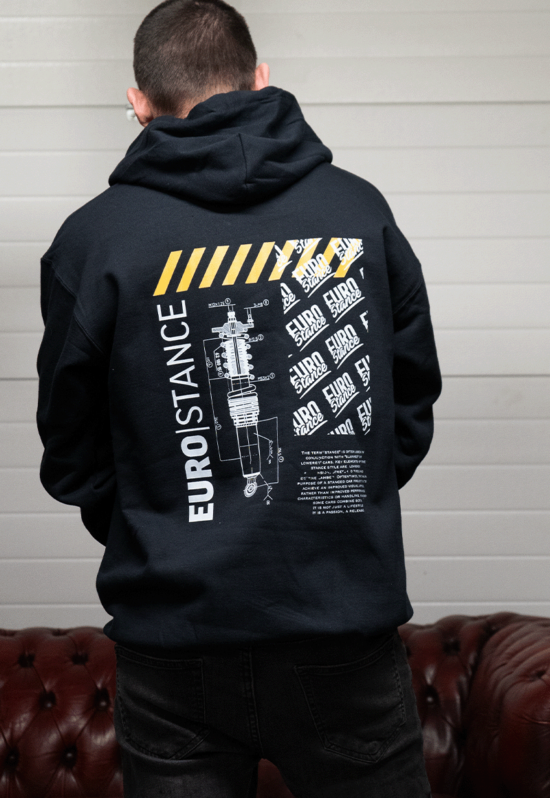 EuroStance Stance Defined Hoodie, back print with a coilover drawing worn by a man indoors