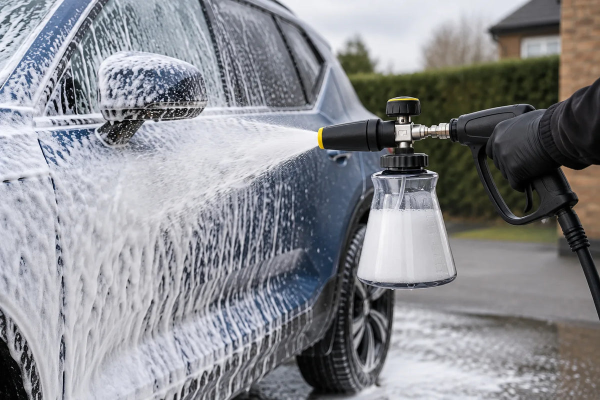 Active Premium Snow Foam Cannon on a pressure washer gun covering the side of a blue car in thick snow foam