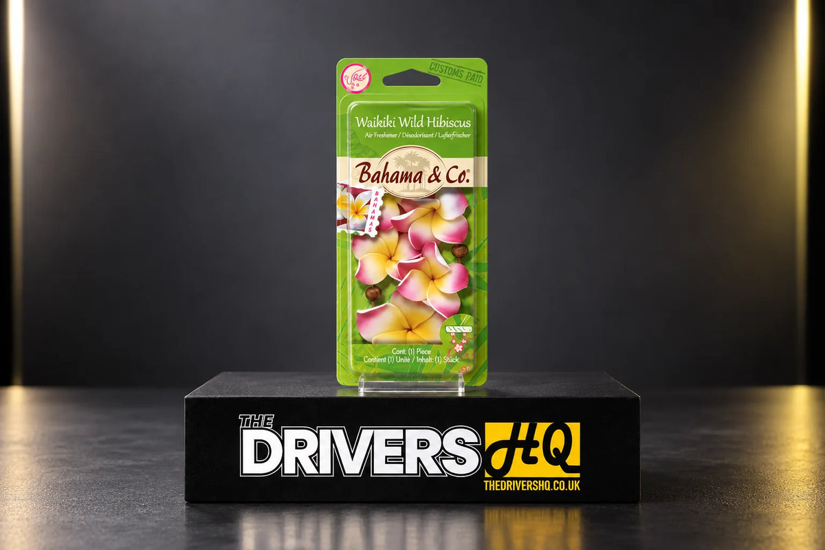 Bahama & Co. Waikiki Wild Hibiscus air freshener necklace in its pack on a black display plinth in a photo studio