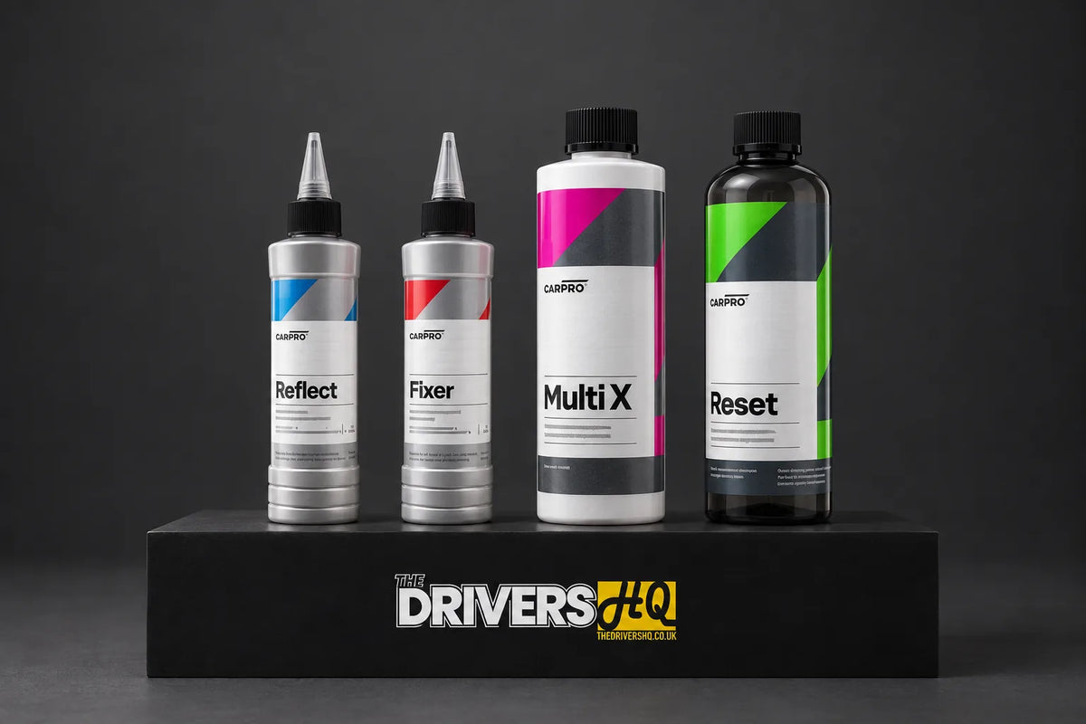 CARPRO Reflect, Fixer, Multi X and Reset on a black display plinth in a photo studio