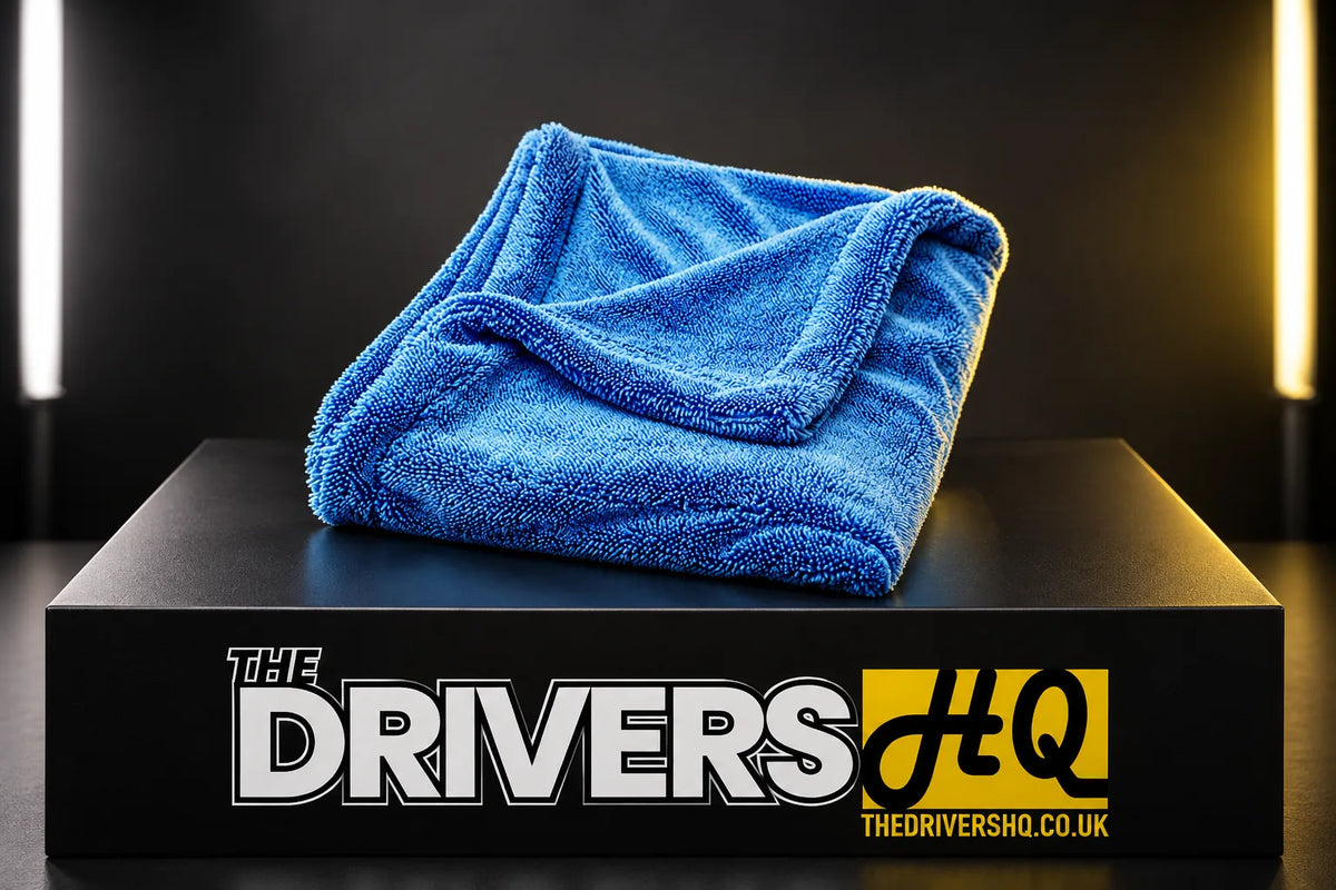 Detailers United Hydro Hoover blue drying towel folded on a black display plinth in a photo studio