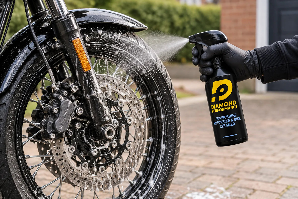 Diamond Performance Super Shine Motorbike & Bike Cleaner being sprayed onto the front wheel and brake disc of a motorbike