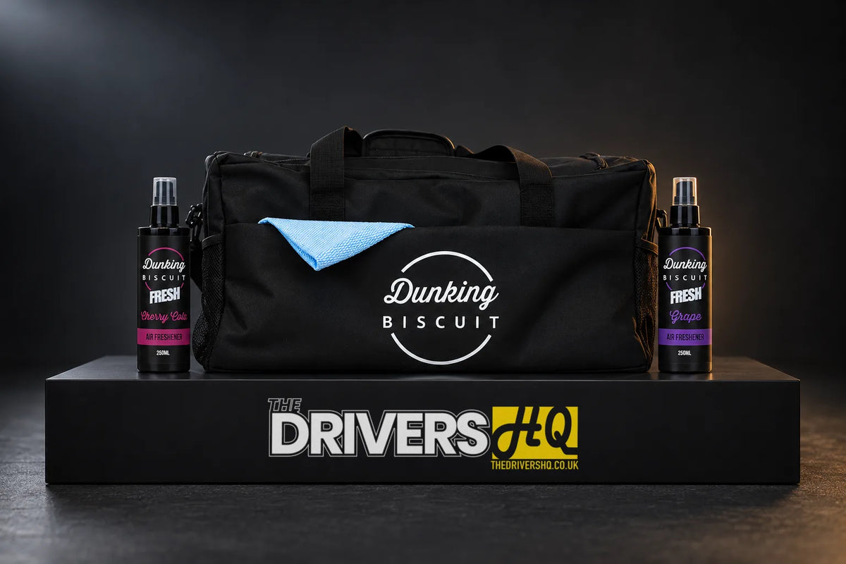Dunking Biscuit Air Fresh Cherry Cola and Grape sprays either side of The Dunking Hauler detailing bag on a black display plinth