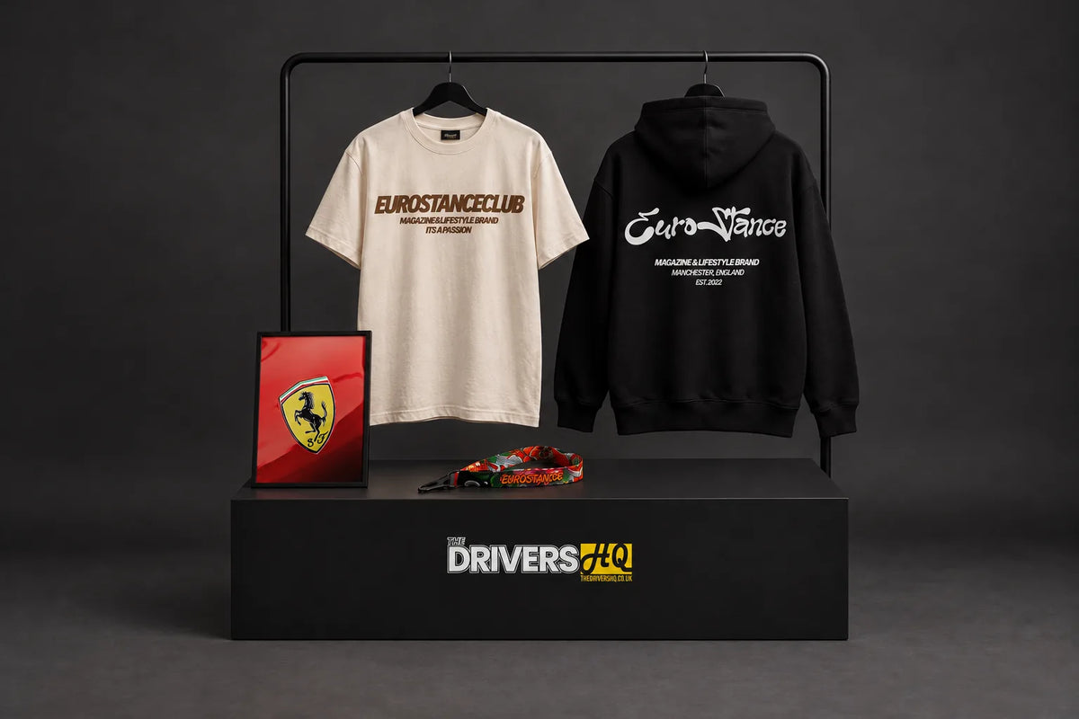 EuroStance Club Lifestyle tee and Lifestyle Script hoodie on a clothes rail with the Ferrari Emblem poster and Koi JDM lanyard in a photo studio