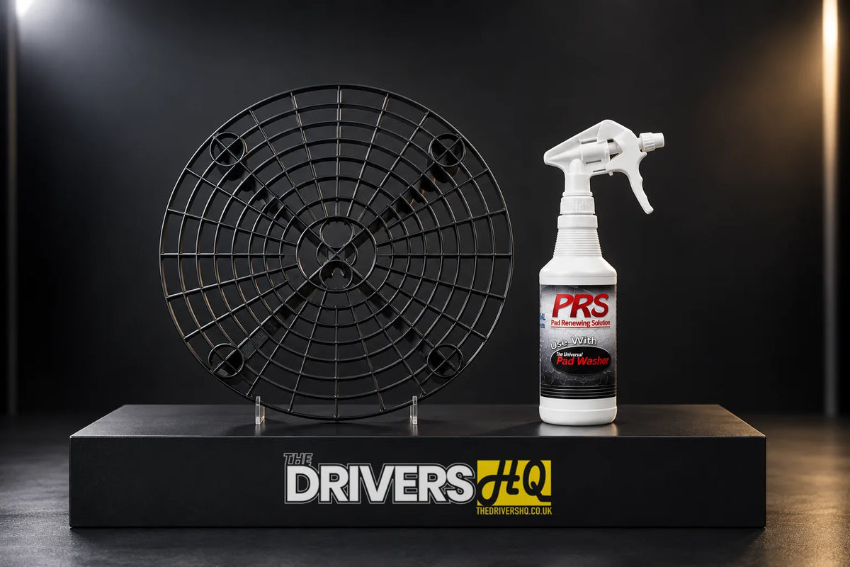 Black Grit Guard bucket insert and PRS Pad Renewing Solution spray bottle on a black display plinth