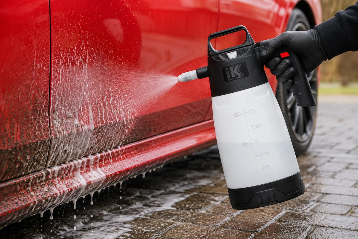 IK Multi Pro 2 pump sprayer foaming the side of a red car on a driveway