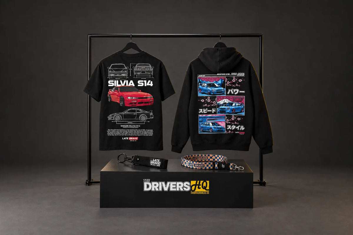 Late Brake Supply Silvia S14 T-shirt and Impreza hoodie on a clothes rail with the LB_JPN keychain and Finish Line lanyard in a photo studio