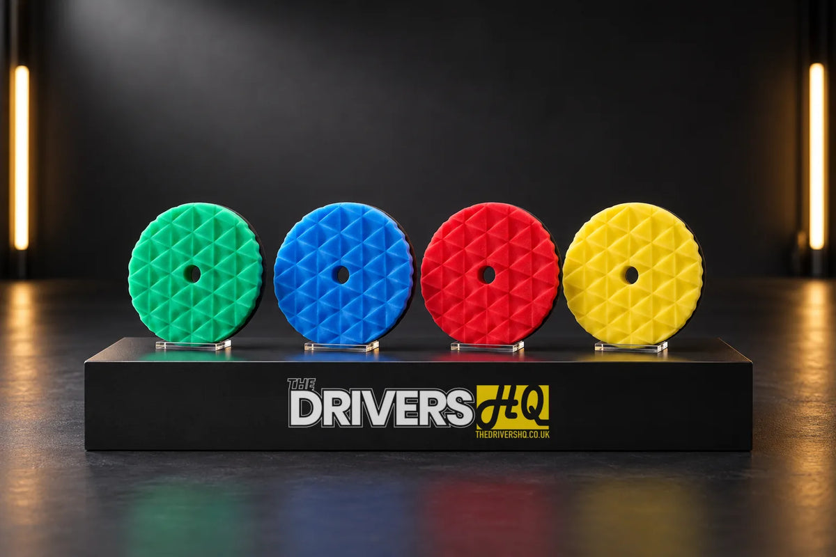 Four ShineMate Black Diamond foam polishing pads on stands on a black display plinth